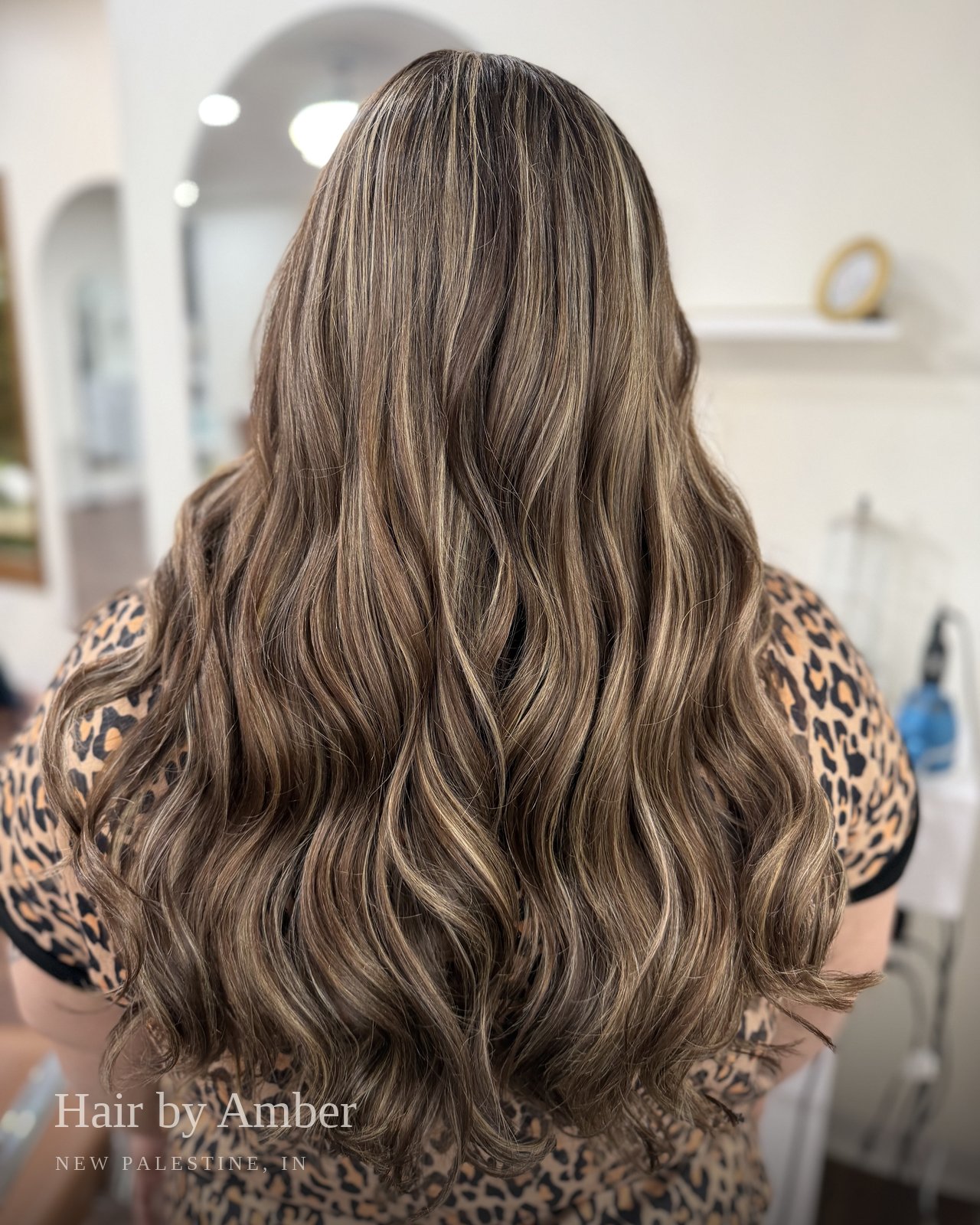 Hair by Amber — dimensional brunette to blonde, long waves